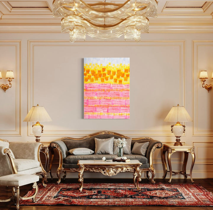 The artwork 'Sunflower, No.4 (Fruit Striped)' by Taylor Binda features a vibrant abstract composition with playful geometric squares in yellow tones transitioning to pink horizontal stripes. The 48x36 inch acrylic painting creates a dynamic pattern reminiscent of a sunset gradient, displayed against a neutral wall in an elegant living space. By Taylor Binda.