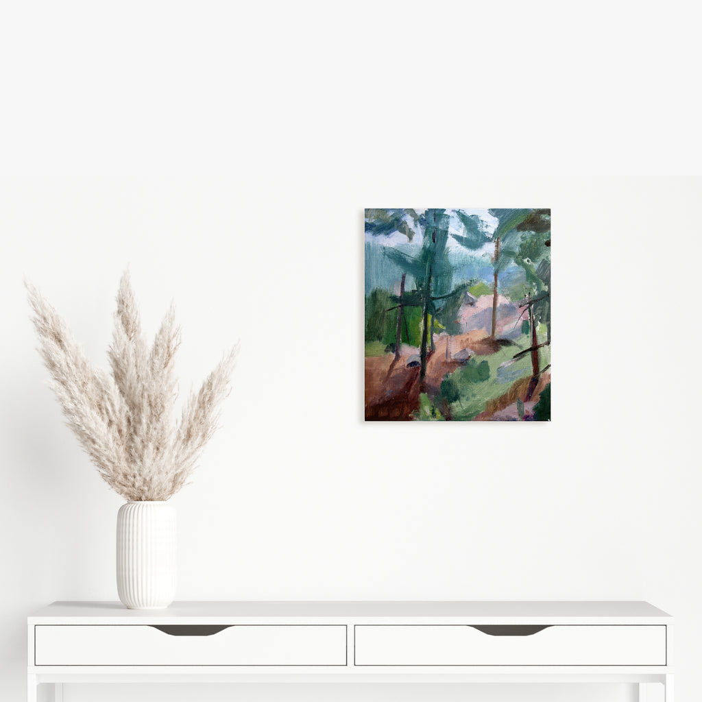 The artwork 'Green Mountain Falls, CO' by Peter Colquhoun captures a vibrant mountain landscape with towering evergreen trees against a dynamic sky. Oil on linen painting features bold brushstrokes creating textural forest paths in earthen browns, contrasting with deep greens and atmospheric blue hues. The composition showcases a natural Colorado wilderness scene in an impressionistic style.