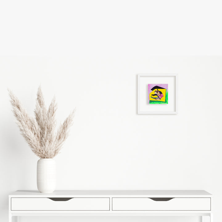 Artwork 'Fragment#07' by Winnie Sidharta: Mixed media collage featuring vibrant neon green and magenta abstract shapes, watercolor textures, and magazine cutouts on a white panel, displayed in a minimalist white frame. A contemporary piece measuring 5x5 inches, showcasing dynamic composition against a neutral background.