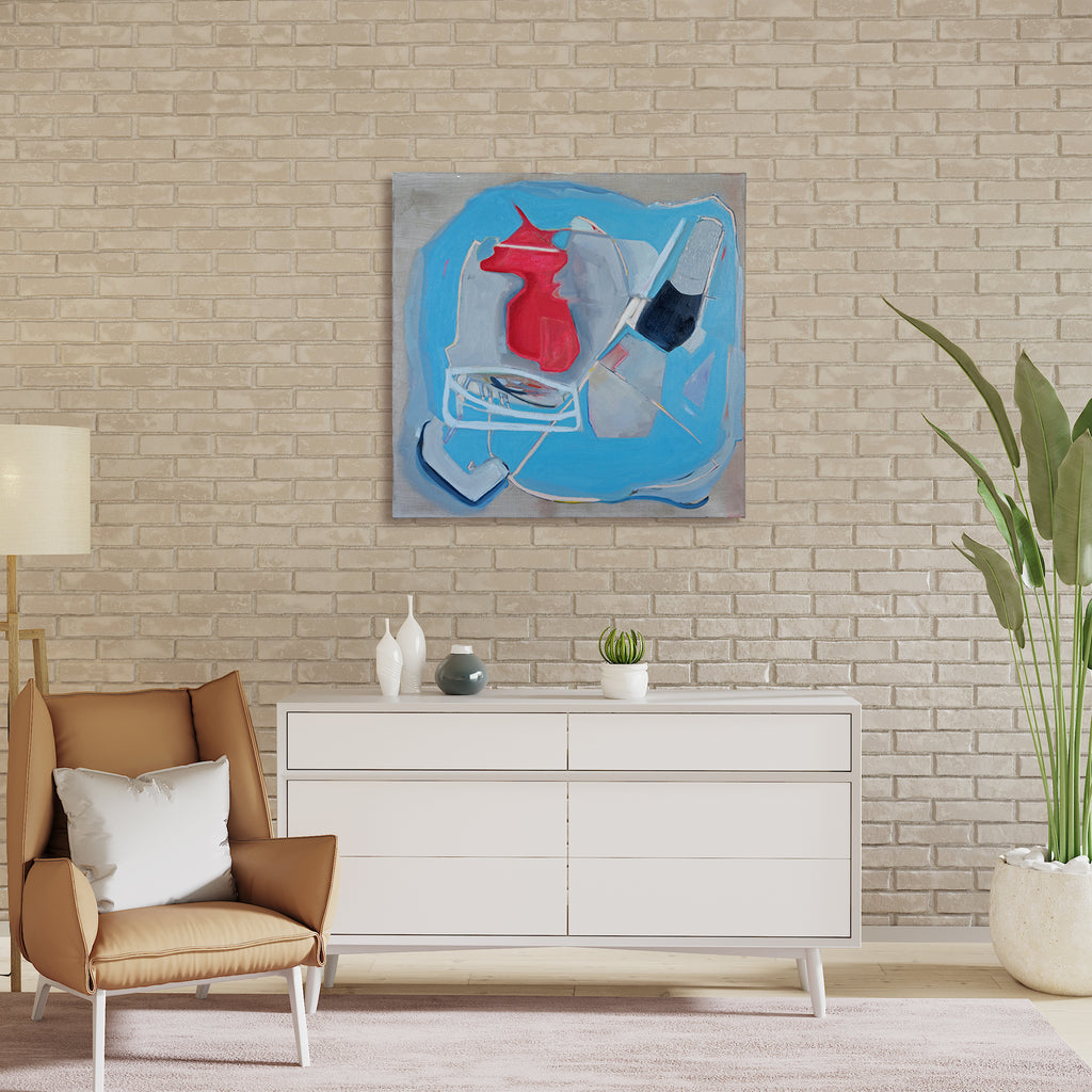 The artwork 'The Mind/Body Problem' features abstract geometric shapes in vibrant turquoise blue and bold red against a silvery gray background. The composition shows dynamic, angular forms with fluid brushstrokes in oil paint, creating a sense of movement and spatial depth. Sharp lines and soft edges interplay throughout the 38-inch square canvas. By Gail Winbury.