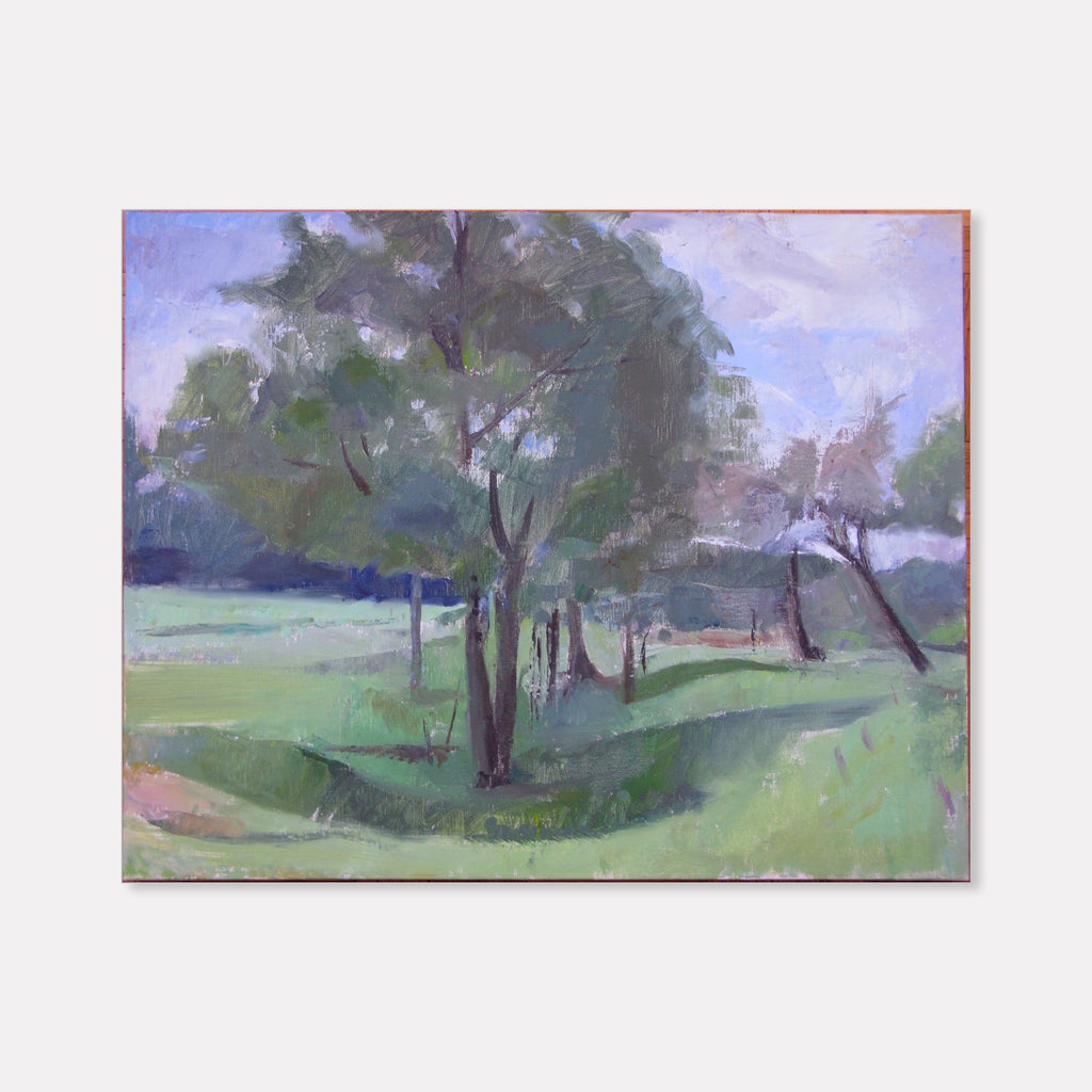 The artwork 'Meadow, La Grange du Bois' by Peter Colquhoun depicts a serene landscape with scattered trees against a misty purple-blue sky. Oil on linen captures soft green meadows rolling into the distance, with delicate brushstrokes creating atmospheric depth through muted tones and loose, impressionistic style.