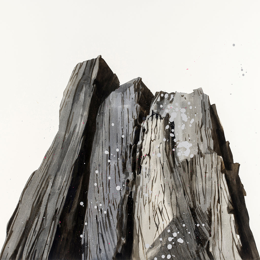 The artwork 'Shale' by Theresa Bloise depicts a dramatic monochromatic mountain formation in acrylic on paper. Angular peaks rise upward with textured striations and speckled details, creating a rugged, geological appearance in shades of black, grey, and white. The minimalist composition captures the raw, weathered essence of rock formations through bold brushstrokes and organic splatters.