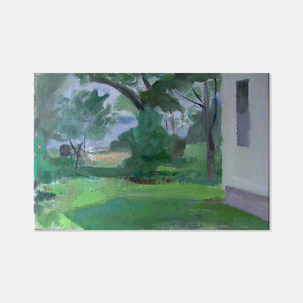 The artwork 'Side Yard, Thomasville' by Peter Colquhoun depicts a serene garden landscape with lush green foliage and tall trees. Brushstrokes of emerald and sage create a verdant lawn, while hints of gray indicate a house structure. The oil on linen painting captures dappled sunlight and natural shadows in an impressionistic style, conveying a peaceful Southern garden atmosphere.