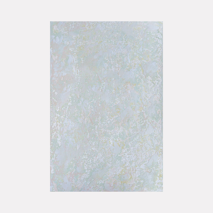 The artwork 'Muro II' by Jacqueline Ferrante features ethereal layers of pale blue and white textures created with powdered gesso and acrylic. The abstract composition reveals subtle iridescent highlights that shimmer across the textured surface, creating a dreamy, cloud-like effect on watercolor paper. Art by Jacqueline Ferrante.