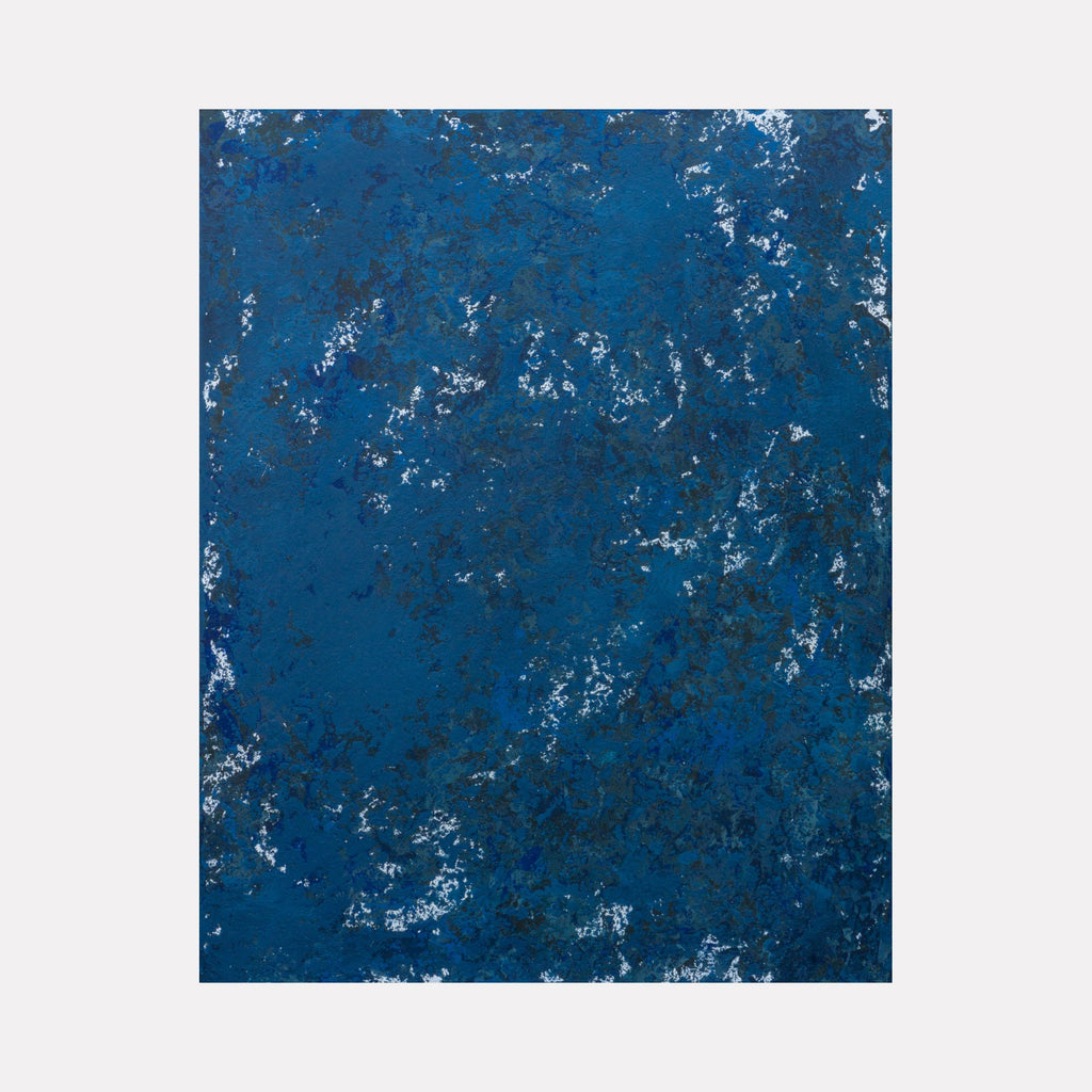 The artwork 'Sea green, see blue' by Jacqueline Ferrante features an abstract composition with deep oceanic blues and subtle sea green undertones. Textured acrylic brushstrokes on birch panel create a weathered, organic pattern reminiscent of waves and seafoam, with white speckled details throughout the 14x11 inch surface.