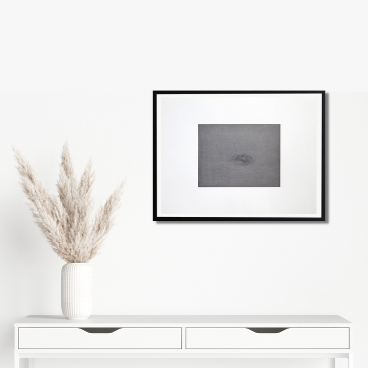 COSTA RICA CLAY #10 by Barbara Groh features a minimalist monochromatic composition in oil and gesso. The abstract artwork displays subtle grey tones on Strathmore paper, framed in black against white matting. A delicate, ethereal form emerges from the misty grey background, creating a contemplative atmosphere. The 17x23 inch piece exhibits refined textures through oil and turpentine technique.