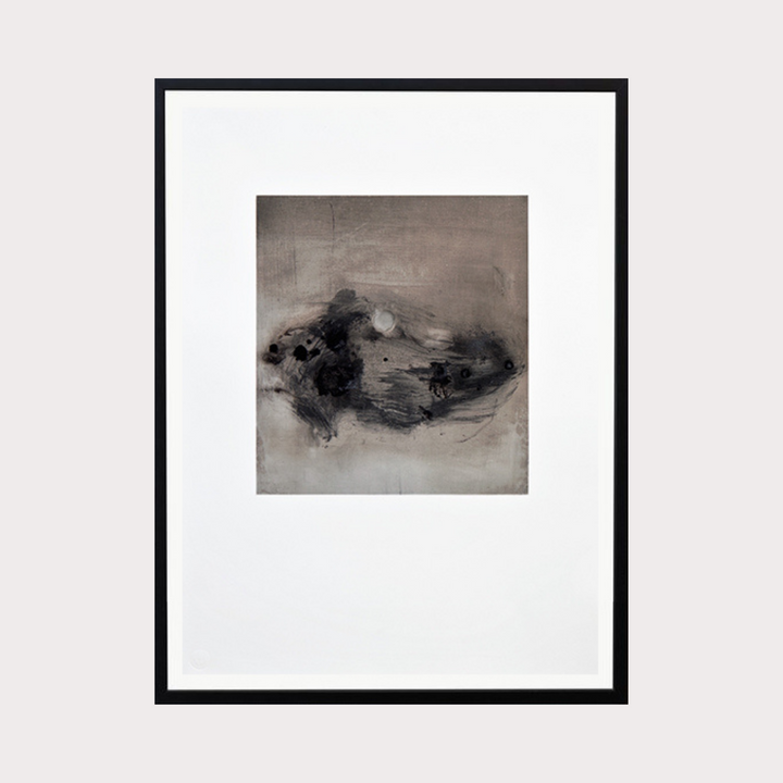 The artwork 'Costa Rica Clay #7' by Barbara Groh features an abstract composition in monochromatic tones, with dynamic brushstrokes creating a central mass of smoky grays and deep blacks against a light background. The oil and graphite medium creates textural contrasts, while gestural marks suggest natural forms in motion. Framed in black, mounted on white.