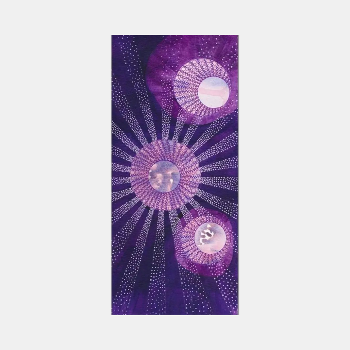 The artwork 'The Spheres Really Have Their Music #49' by Katie Niewodowski features three luminous orbs in shades of pink and purple against a deep violet background. Detailed dotted patterns radiate outward from each sphere, creating a cosmic, starburst effect. The intricate ink and acrylic work combines precise pointillism with fluid color transitions.