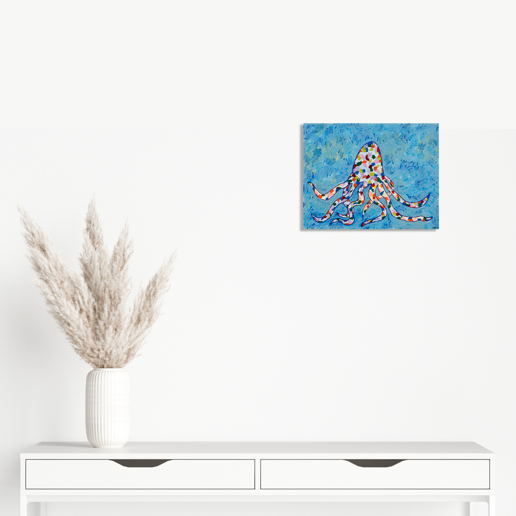 Artwork 'Rainboctopus #2' by Aaron Hillebrand features a whimsical octopus painted in vibrant geometric patterns against a textured bright blue background. The octopus is rendered in a playful mosaic style using warm oranges, reds, and whites, creating a dynamic contrast with the sea-inspired turquoise backdrop. Acrylic on art board by Aaron Hillebrand.