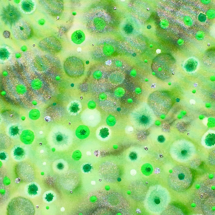 The artwork 'Greeniliscious' by Eric Jiaju Lee features a mesmerizing abstract composition of vibrant green orbs and circles floating in a luminous space. The painting showcases varying sizes of spherical forms with glowing centers, creating a microscopic or celestial effect. Metallic silver accents shimmer throughout the 35x35 inch acrylic canvas, adding depth and dimension to the ethereal green palette. By Eric Jiaju Lee.