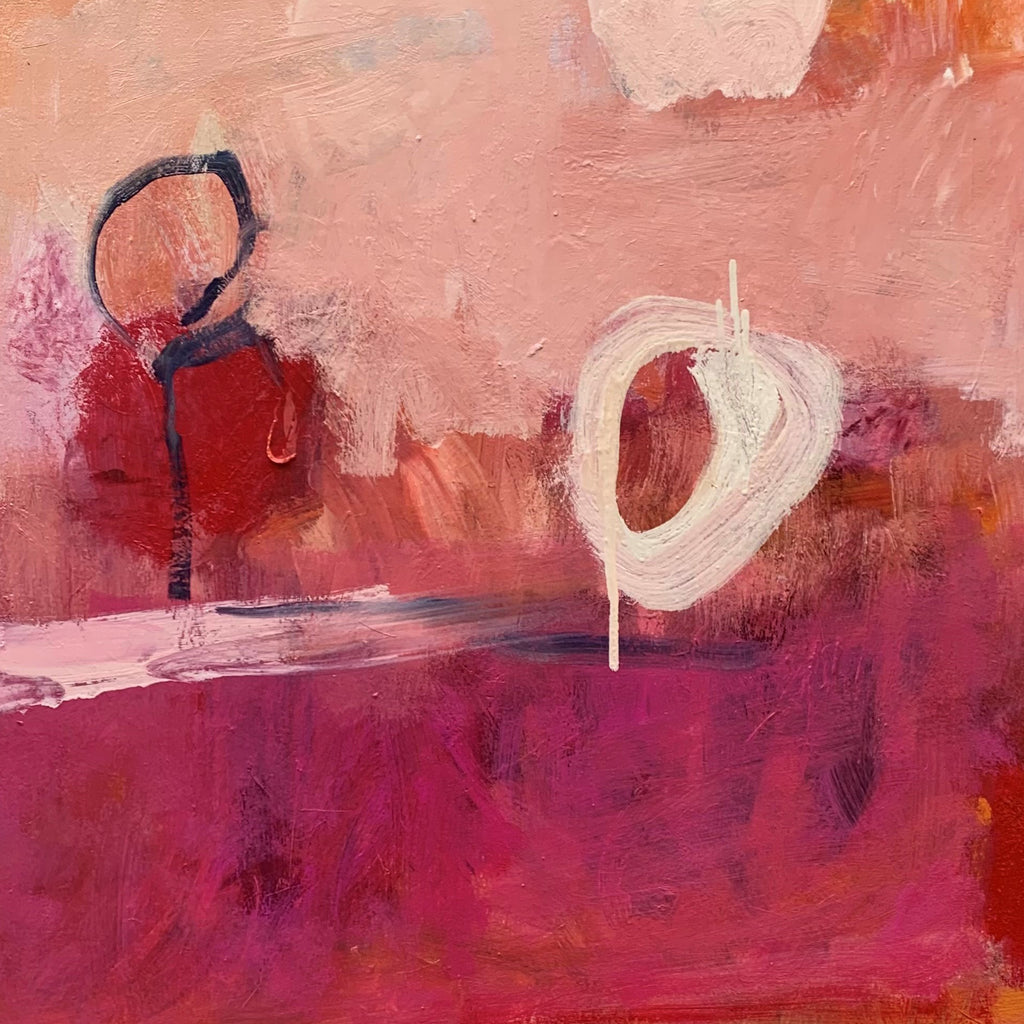 The artwork 'October' by Kevin McGoff features abstract circular forms in navy blue and white against a vibrant background of pink and magenta hues. The oil painting showcases expressive brushstrokes creating textural depth, with the circles appearing to float in a dreamlike landscape. The composition balances bold color contrasts with subtle peach tones in a contemporary abstract style.