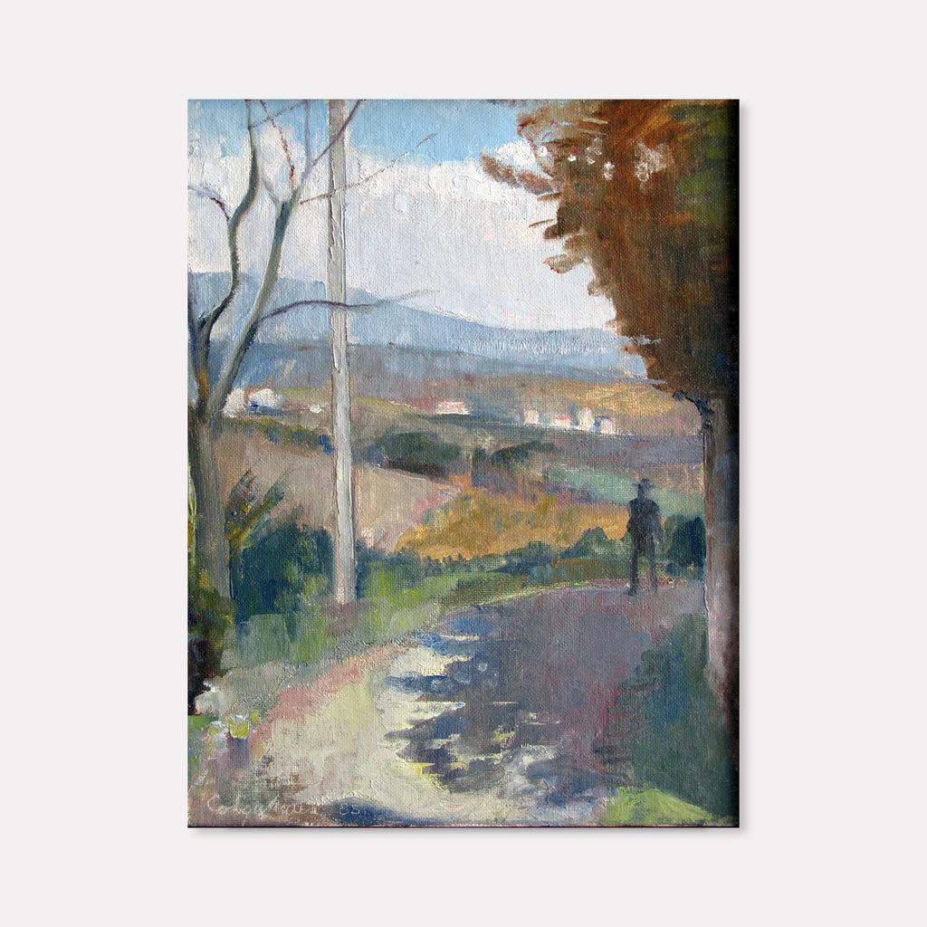 The artwork 'Casole Walking Path' by Peter Colquhoun captures a serene countryside scene with bare winter trees framing a winding path. Soft blues and grays dominate the misty mountains in the background, while autumn browns and greens paint the rolling hills. Distant white buildings dot the landscape, with shadowy figures walking along the sunlit path. Oil on canvas board, 12x8 inches.