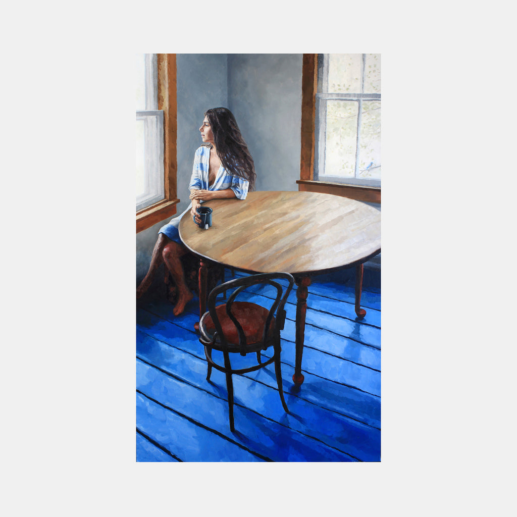 The artwork 'Chipped and Cracked' features a contemplative scene with a round wooden table, vintage bentwood chairs, and vibrant blue painted floorboards. Natural light streams through corner windows, casting soft shadows across a muted blue-gray wall. The oil painting captures an intimate interior space with rich contrasts and careful attention to light and texture by Elody Gyekis.
