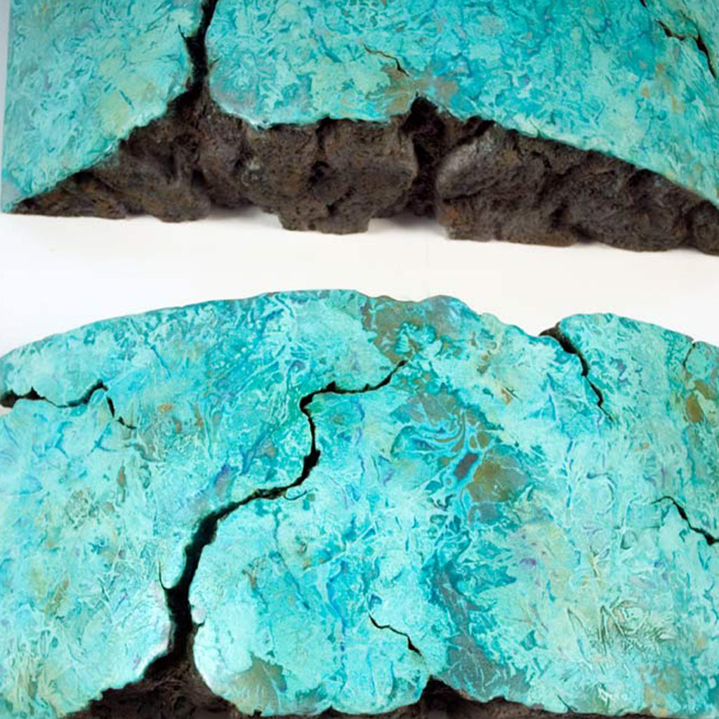 The artwork 'CONNECTED lll' by Nora Chavooshian features a dramatic sculptural piece cast in forton with bronze patina, showcasing organic, fractured forms in vibrant turquoise tones contrasting with deep charcoal crevices. The textured surface creates a geological, crystal-like appearance, displaying natural weathering patterns and erosion-like details.