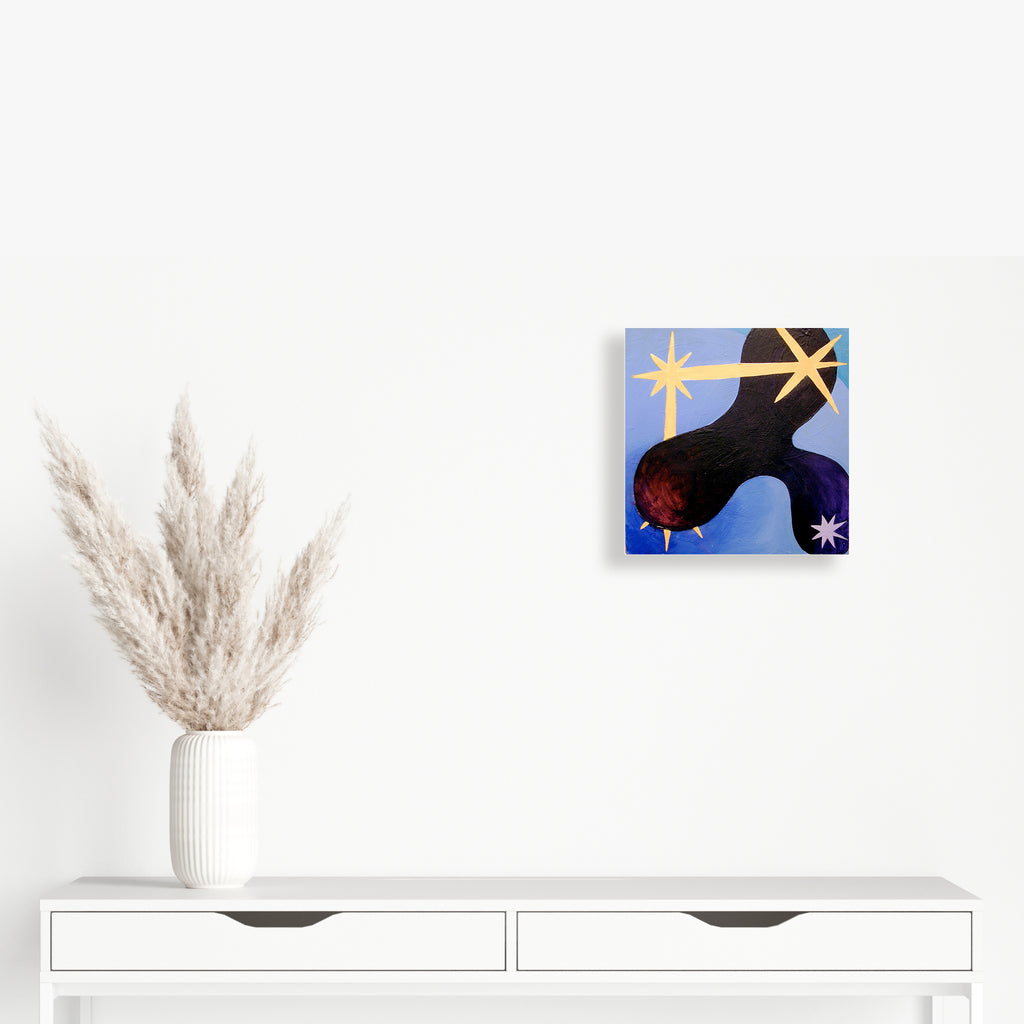 The artwork 'Constellation #4' by Fred Bendheim features a striking abstract composition with a black organic shape against a vibrant blue background. Golden star-like forms radiate across the canvas, while a deep red circular element adds dynamic contrast. Oil on board painting showcases smooth texture and celestial-inspired modern design, 18x18 inches - by Fred Bendheim.