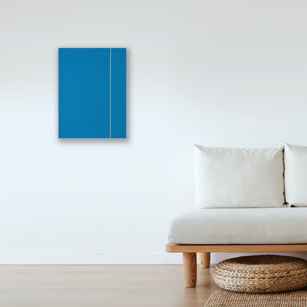 The artwork 'Course' by Shyun Song features a minimalist composition with a vibrant azure blue rectangular canvas bisected by a subtle vertical white line. This contemporary oil painting, mounted on a stark white wall, embodies geometric abstraction with its clean lines and monochromatic palette, creating a striking visual balance. Oil on canvas, 24x18 inches. By Shyun Song.