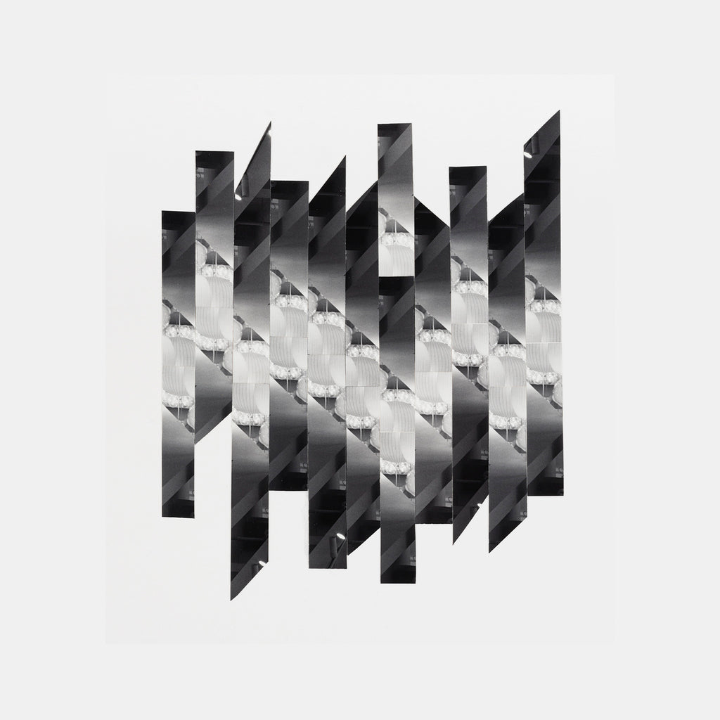 The artwork 'Diagonals' by Adrienne Moumin features a striking black and white geometric photo collage composed of diagonal strips creating an abstract pattern. Hand-cut silver gelatin prints are arranged in a rhythmic sequence, alternating between light and dark values, forming a dynamic architectural composition with sharp angular intersections.