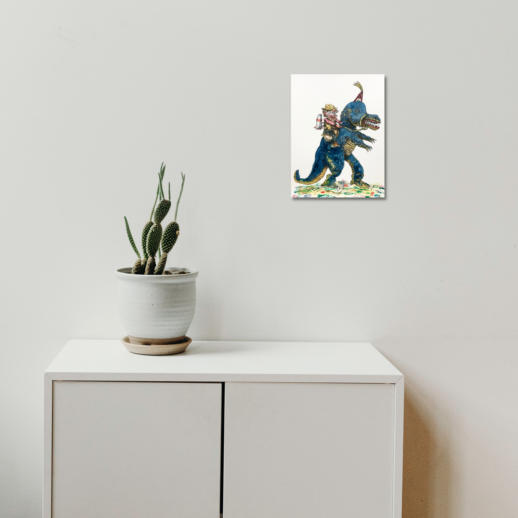 The artwork 'Dino Cowboy' by Andrew Chan features a whimsical illustration of a blue Tyrannosaurus Rex wearing a brown cowboy hat and boots, rendered in ink and watercolor. The dinosaur is depicted in a playful striding pose against a white background, combining Wild West and prehistoric themes in a 12x9 inch composition.
