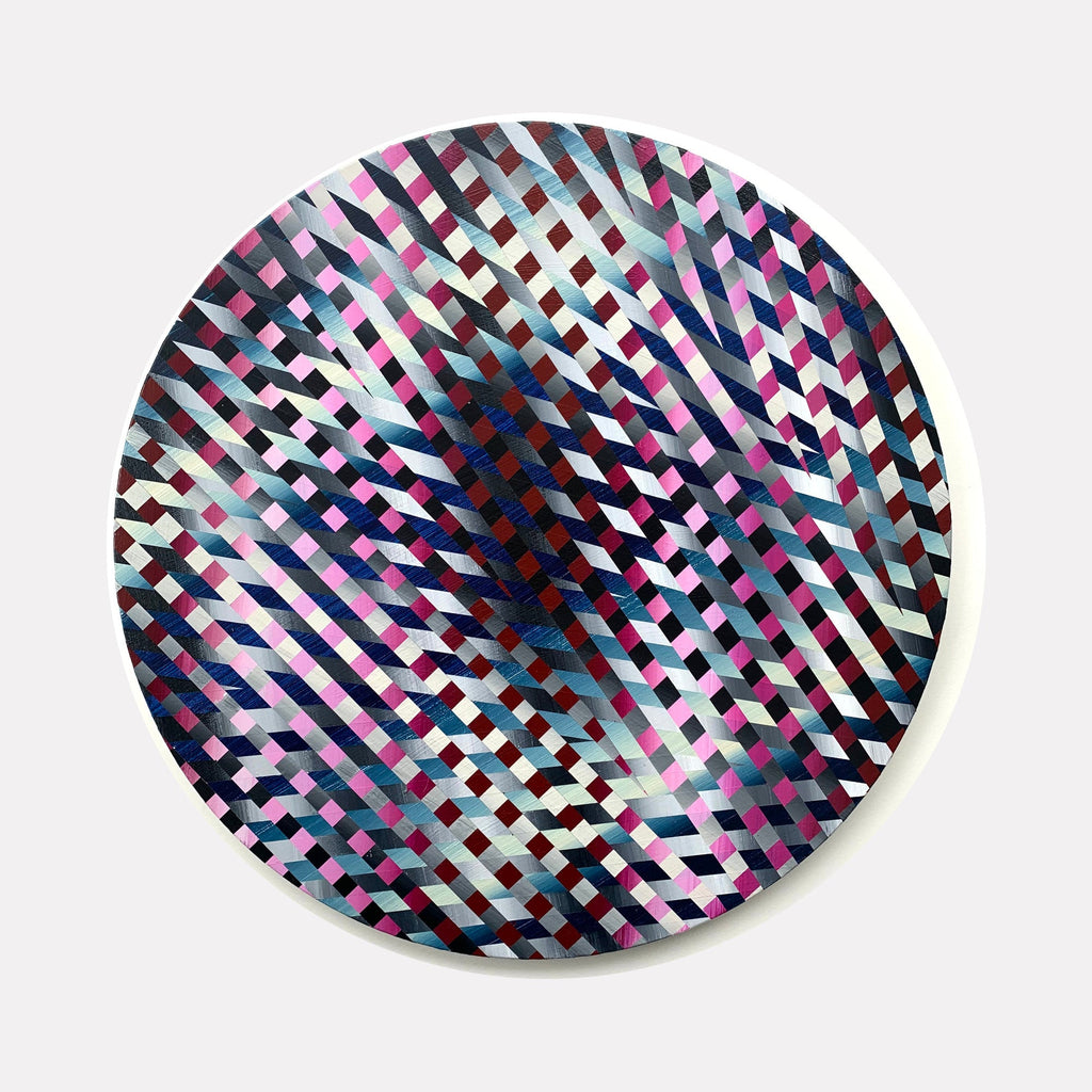 The artwork 'Don't Look Back' by Elyce Abrams features a mesmerizing geometric pattern on a round wood panel, composed of interwoven diagonal lines in vibrant pink, navy blue, and silvery gray. The repeating diamond-like shapes create an optical illusion of movement and depth across the 20-inch circular surface, painted in acrylic with a modern, abstract style.