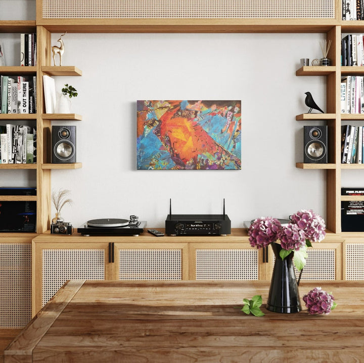 The artwork 'Double Gate' by James Ehling features vibrant abstract composition with explosive orange and turquoise hues swirling together in dynamic motion. Mixed media artwork combining acrylic paint, textured fabric, and tissue paper creates depth and visual interest. Mounted in modern living space, 20x30 inches. Artwork by James Ehling.