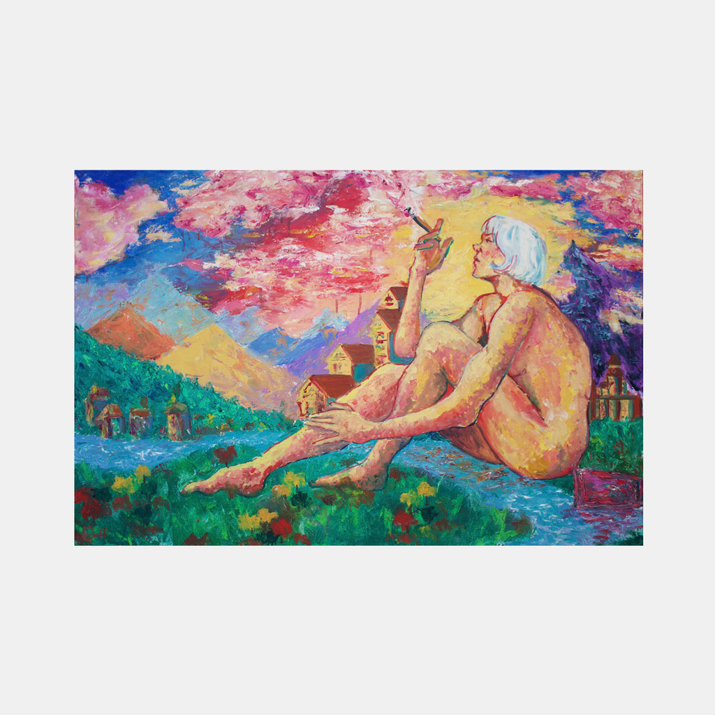The artwork 'Fantasy' depicts a figure reclining on vibrant green grass against a dreamlike landscape with distant houses. The sky bursts with swirling pink, blue, and golden clouds. Rich, expressive brushstrokes create a post-impressionist style scene with mountains and water. The composition features bold, warm colors and whimsical architectural elements in the background. Oil painting by Jadie Meprivert.