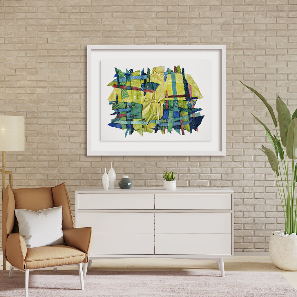 The artwork 'Feeling Lush' by Christina Massey features an abstract composition with intersecting geometric shapes in vibrant yellows and deep blues. The mixed-media piece combines acrylic paint, linocut printing, and threaded elements, creating a dynamic interplay of textures and patterns. The artwork appears to float within a white frame against textural canvas and paper.