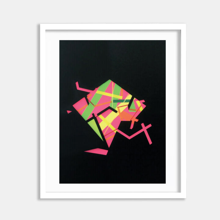 The artwork 'Fllormma 7' by Philippe Halaburda features vibrant geometric shapes in neon pink, lime green, and orange arranged in an abstract, dynamic composition against a deep black background. The collage combines color tape creating angular forms that suggest movement and energy, presented in a white frame.