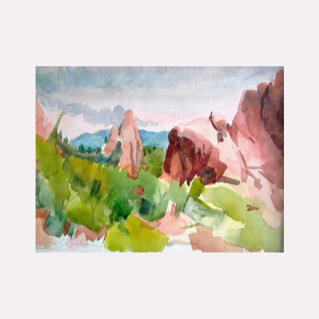 The artwork 'Garden of the Gods' by Peter Colquhoun depicts majestic red sandstone formations rising against a misty blue sky. Soft watercolor technique captures towering rock spires in coral and russet hues, complemented by verdant green vegetation in the foreground. The 9x12 inch landscape painting conveys the natural grandeur of the iconic Colorado landmark.
