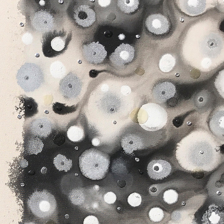 The artwork 'Getting Together' by Eric Jiaju Lee features ethereal circular patterns in monochromatic tones, creating a mesmerizing abstract composition. White and gray orbs with delicate halos float against a gradient background, resembling celestial bodies or microscopic organisms. The 35x35 inch acrylic painting demonstrates a unique water-media technique, producing organic, floating forms that merge and interact across the canvas.