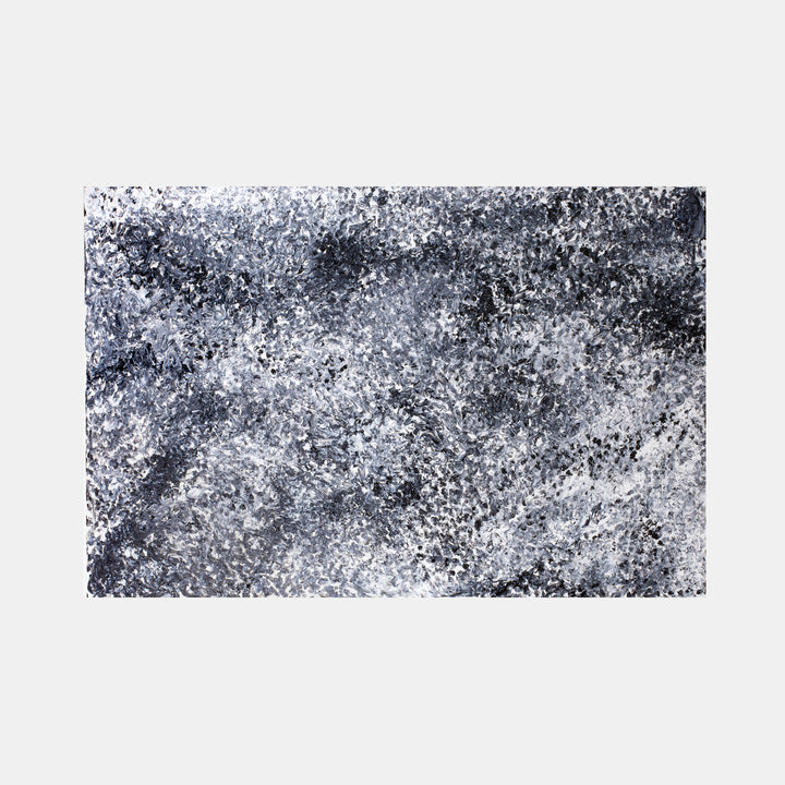 The artwork 'Hollywood Hills' by Camilla Webster features an abstract expressionist landscape in monochromatic tones. Dynamic brushstrokes create a textural composition of black, white, and silvery gray hues, suggesting a misty aerial view. The 48x72 inch acrylic on canvas captures a moody, atmospheric perspective with speckled effects and layered paint techniques by Camilla Webster.