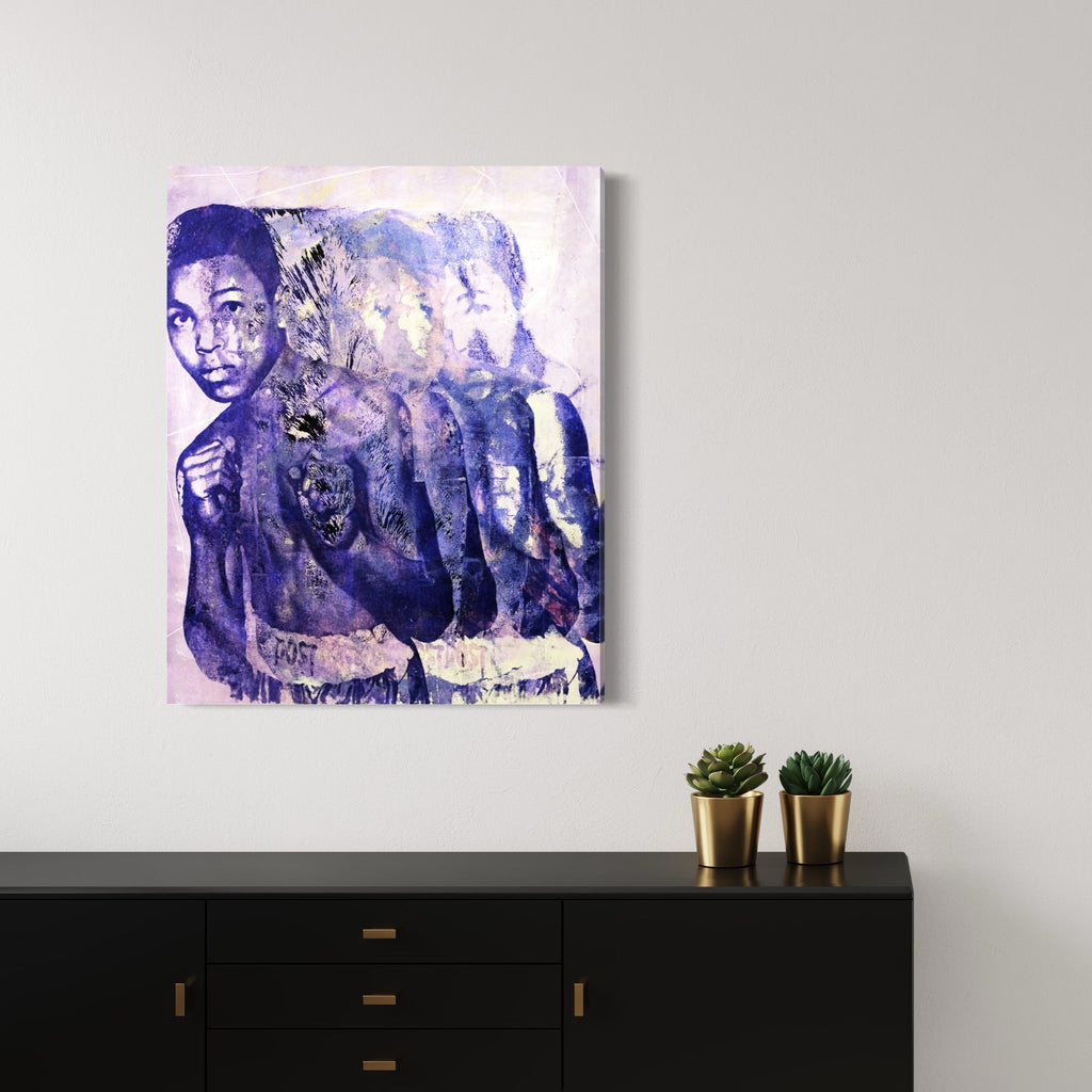 The artwork 'Fighting Is The Way' by Rudy Meyer features a striking mixed-media composition in shades of purple and blue, showcasing a dynamic silhouette repeated in a motion-like sequence. The piece combines silkscreen printing, spray paint, and acrylic on canvas, creating a layered ethereal effect with overlapping translucent forms against a light background.