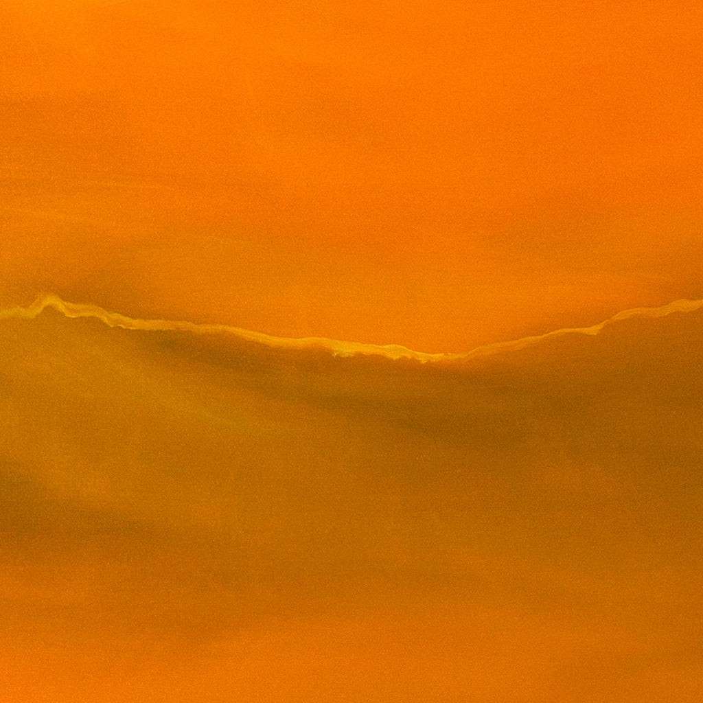 The artwork 'I Know This Place' by Camilla Webster features a vibrant abstract landscape in warm amber and golden orange hues. A subtle horizon line divides the composition, suggesting a minimalist sunset or sunrise scene. The acrylic on canvas piece showcases smooth color gradients and atmospheric depth, creating a meditative quality through its monochromatic palette.