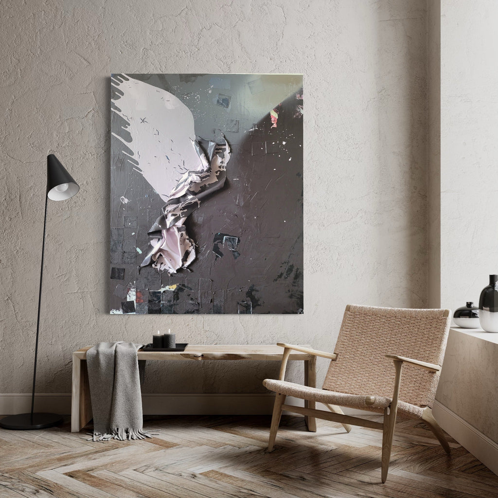 The artwork 'Graduation Day' by Roger Hsia features a dynamic, abstract composition with a crumpled paper-like form emerging from a dark gray background. The central figure appears wing-like, rendered in white and pale pink tones, creating a dramatic contrast against the textured, industrial-style backdrop. The acrylic painting combines sculptural elements with splatter effects and geometric shapes scattered throughout the 60x48 inch canvas.