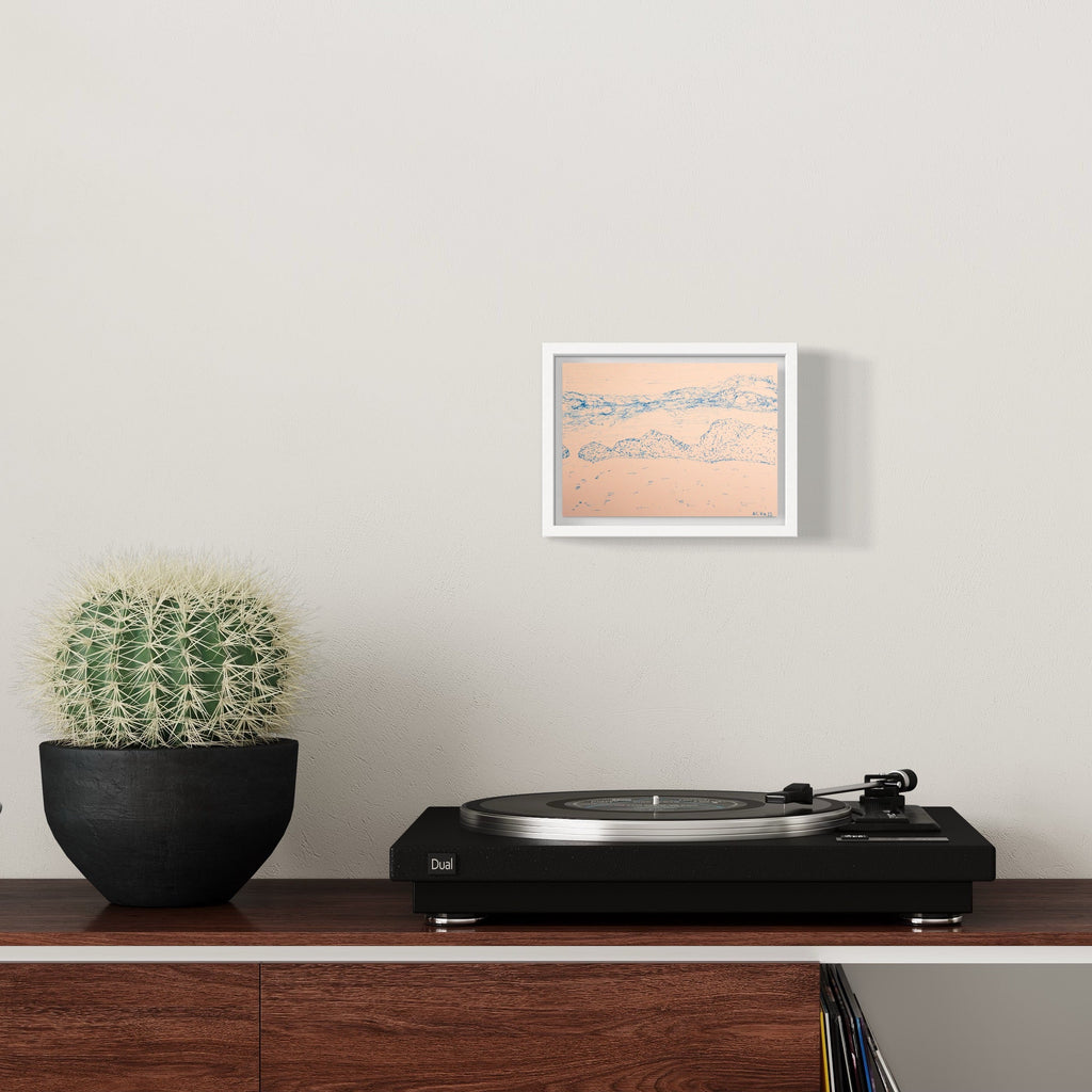 The artwork 'Drake Passage' by Ali Ha features delicate ink drawings on warm white Stonehenge paper, depicting abstract mountainous landscapes in soft peach and gray tones. The piece is elegantly presented in a crisp white frame, showcasing minimalist line work and subtle shading that captures the essence of rugged terrain. - Ali Ha