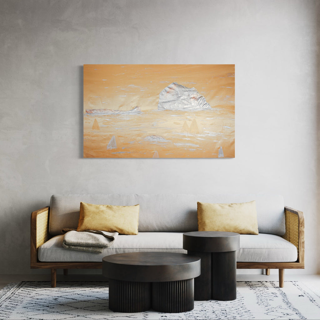 The artwork 'Drifting In Gold' by Ali Ha features an ethereal seascape rendered in warm golden hues with delicate white sailboats gliding across the horizon. Created using repurposed satin fabric in applique technique and acrylic paint, the piece showcases billowing clouds against a luminous orange sky, creating a dreamy maritime atmosphere with textural depth and dimensional elements.