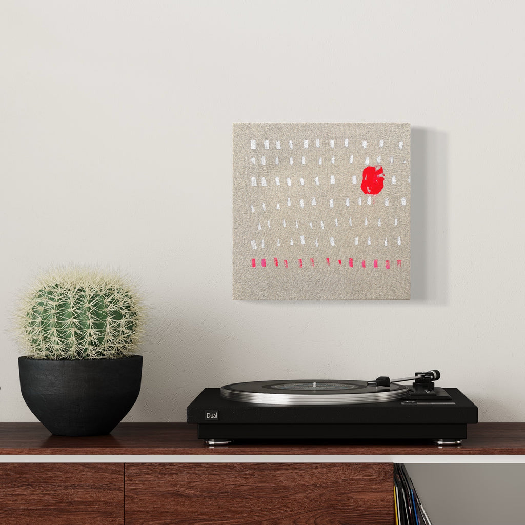 The artwork 'Pink Dots' by Songyi Kim features a minimalist composition on raw canvas with white and pink dots arranged in a grid pattern, highlighted by a singular bold red accent. Set against a neutral beige background, the 12x12 inch piece combines acrylic paint and marker techniques, creating a modern geometric abstract design. By Songyi Kim.