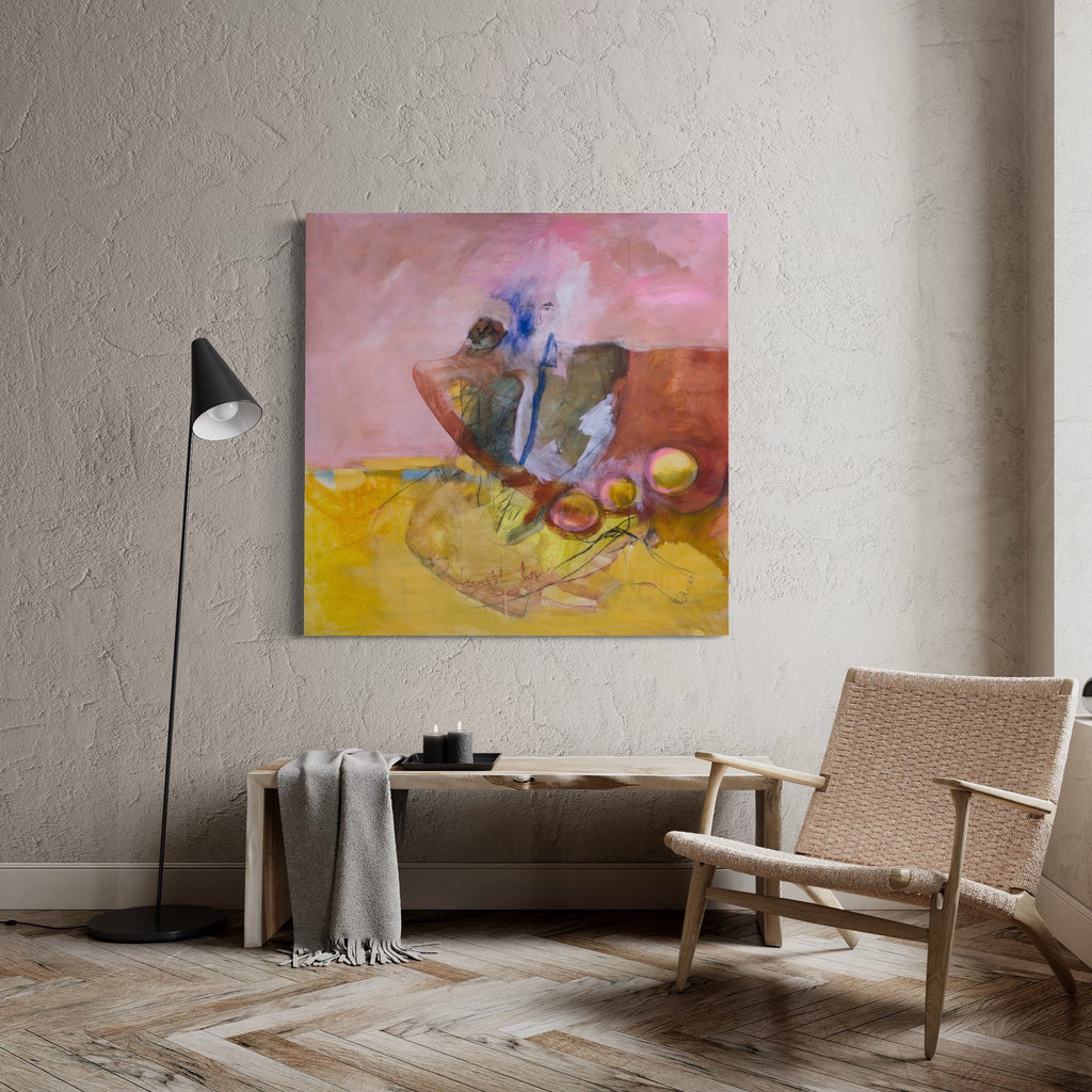The artwork 'Resting on Andrew's Shoulder' by Lauren Orscheln features an abstract composition with fluid forms in rich pink and yellow hues. Abstract figures blend into a warm landscape, with touches of blue accents and brown earth tones. Created with acrylic and graphite on canvas, the piece showcases expressive brushwork and textural elements against a dreamy pink sky.