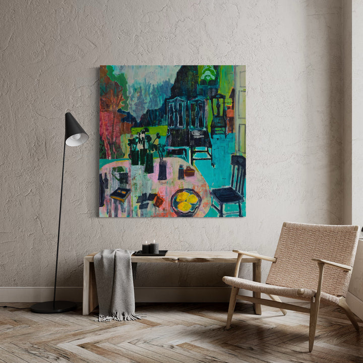 The artwork 'Play the Hand' by Allison Gildersleeve features a vibrant abstract interior scene with chairs and tables rendered in bold turquoise, emerald green, and coral pink. Dynamic brushstrokes create a layered composition with a yellow circular form resembling a plate on a table, set against a complex arrangement of gestural marks in oil and acrylic paint on canvas.