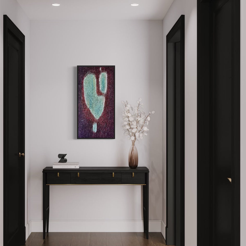 The artwork 'Number 14' by Roberto A Godinez features an abstract composition with a striking turquoise form floating against a deep purple and burgundy textured background. The oil painting, displayed in a modern entryway above a black console table, shows a heart-like shape with ethereal speckled effects. 36x18 inches framed canvas by Roberto A Godinez.