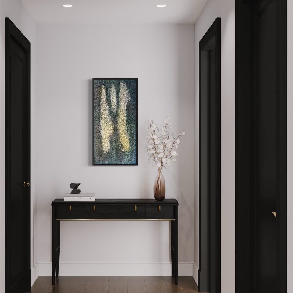 The artwork 'Number 15' by Roberto A Godinez features ethereal vertical streaks of luminous cream-colored paint against a deep teal background, creating an abstract composition reminiscent of falling light. The oil painting on canvas displays a textural, atmospheric quality, mounted in a dark frame above a modern console table, dimensions 36x18 inches. By Roberto A Godinez.
