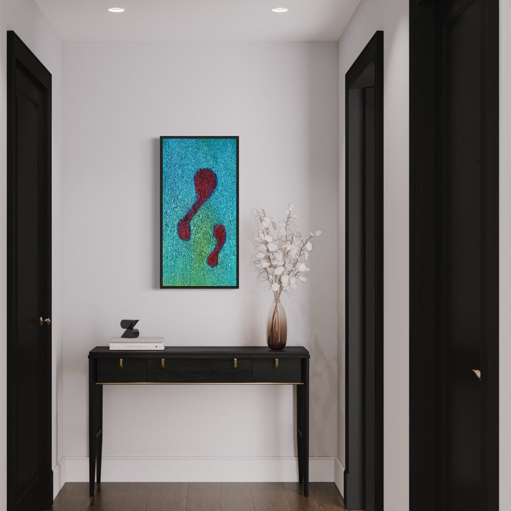 The artwork 'Number 12' by Roberto A Godinez features two abstract crimson footprints floating on a vibrant turquoise textured background. The oil painting, displayed in a sleek black frame against a white wall, creates a striking minimalist composition measuring 36x18 inches. The textured surface adds depth and movement to the contemporary piece.