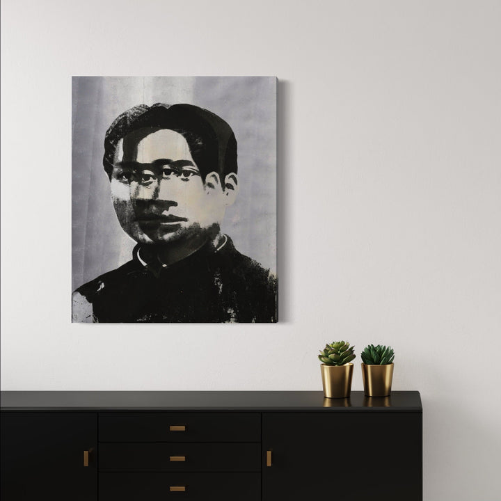 The artwork 'Revolution Is The Way' features a high-contrast monochromatic portrait rendered in silkscreen technique. Bold black strokes against grey background create a striking composition. Hand-pulled silkscreen with ink, spray paint and acrylic on canvas showcases dramatic shadowing and textural elements. Contemporary pop art style canvas measuring 41.34 x 33.46 inches by Rudy Meyer.