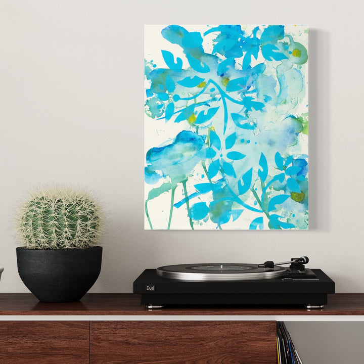 The artwork 'Flowers on A Breezy Day' by Lisa Petker Mintz features a vibrant watercolor-style composition in turquoise and azure blue hues. Delicate leaf-like forms dance across white paper, creating a flowing, ethereal pattern suggestive of botanical elements caught in gentle motion. The acrylic medium lends a translucent, watercolor-like quality to the 20x16-inch piece.