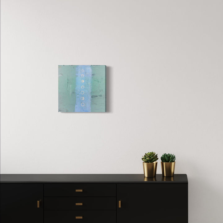 The artwork 'Patch' by Shira Toren features a minimalist composition with a vertical blue stripe centered on a mint green background, created using Venetian plaster and pigment on panel. The textured surface showcases subtle color transitions and weathered effects, measuring 17.5 x 17.5 inches.