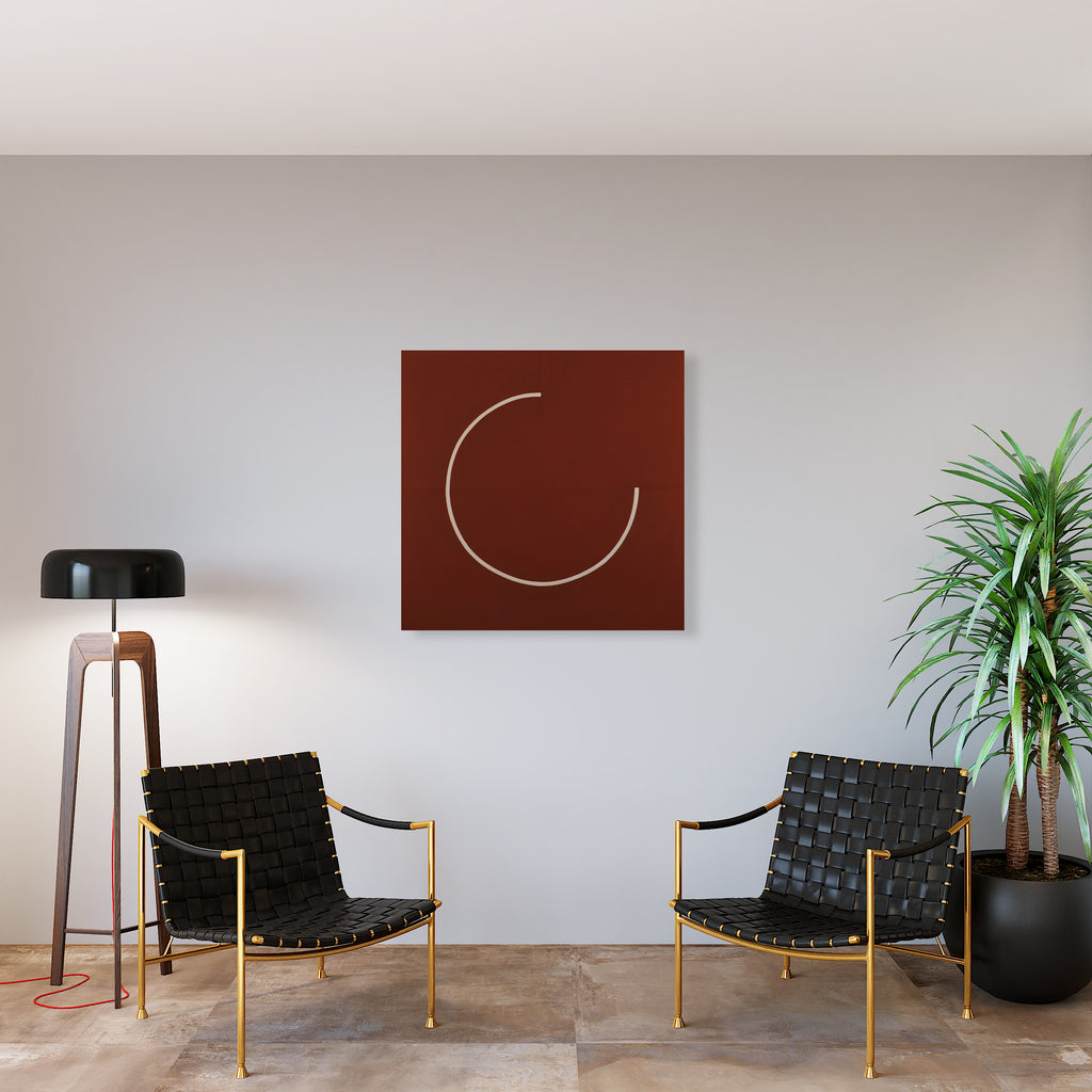 The artwork 'Quest' by Shyun Song features a minimalist design with a simple curved white line forming an incomplete circle against a deep burgundy canvas. The 40x40 inch oil painting creates a striking contrast in a modern interior setting. The piece embodies simplicity and geometric abstraction. By Shyun Song.