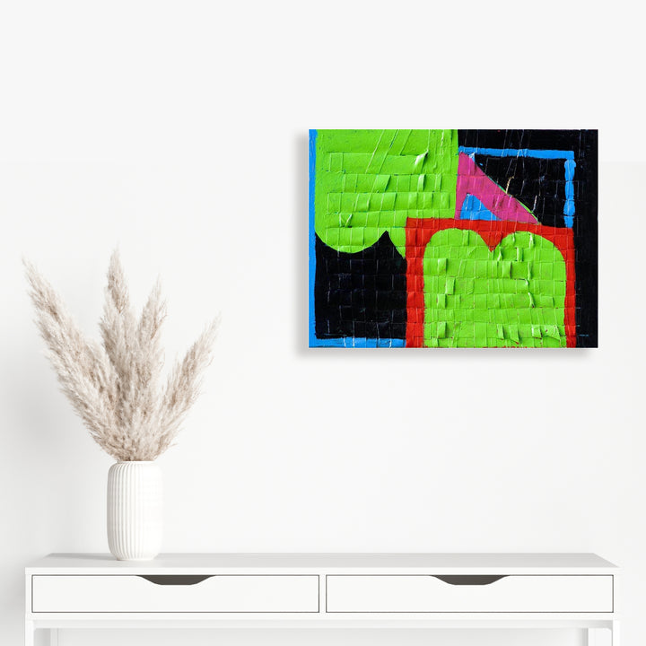 The artwork 'Lots of suggestions Lots of Compliments' by Gyan Shrosbree features vibrant geometric shapes against a black background. Bold lime green forms contrast with a bright blue frame and red accent, creating a dynamic abstract composition with textured brushstrokes on canvas. The acrylic painting showcases a contemporary, graphic style.