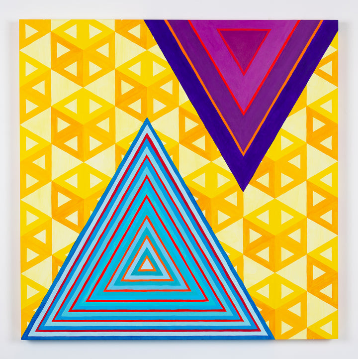 The artwork 'Ideologically Aligned but Still Afraid to Interact' by Amber Heaton features geometric triangular patterns, combining vibrant yellow tessellated background with prominent blue and purple triangular formations. The piece showcases concentric triangles with sharp lines against a repeating yellow triangular grid pattern, creating a bold contrast in a modern abstract style on panel.