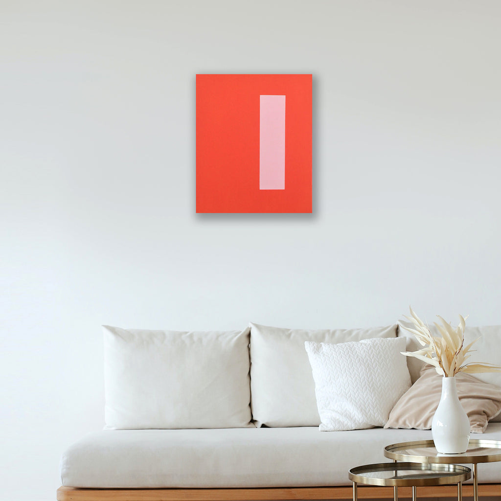 The artwork 'Integrity' by Shyun Song features a striking minimalist composition with a bold coral-red rectangular canvas displaying a single vertical pale pink stripe. The geometric abstract painting creates a powerful contrast against a white wall, embodying modern contemporary style in oil on canvas, 24x20 inches. By Shyun Song.