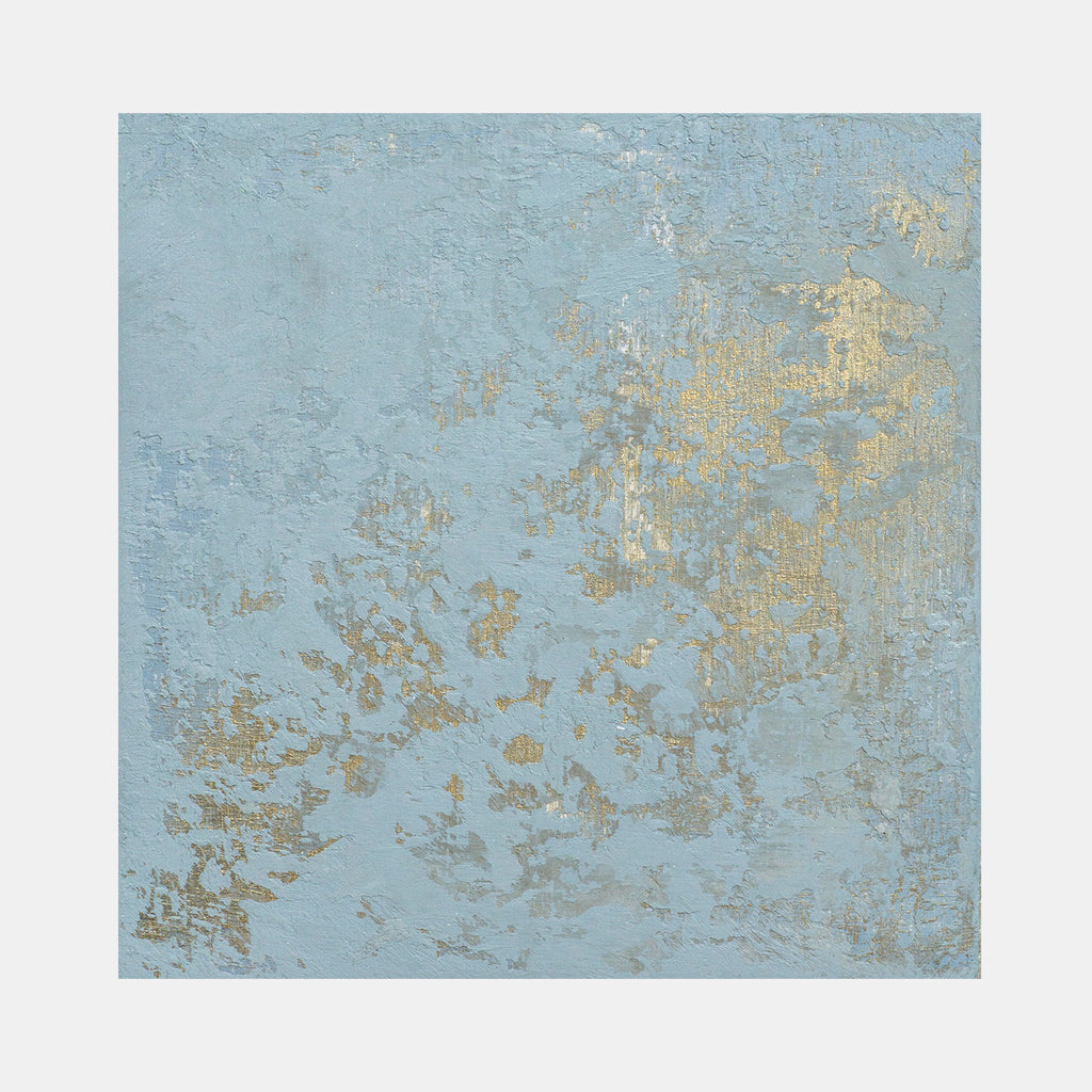 The artwork 'Interference I' features a textured abstract composition on birch panel, combining soft powder blue background with scattered iridescent gold accents creating a weathered, ethereal effect. The acrylic medium creates depth through varied surface treatments, suggesting atmospheric distortion and natural patina. By Curina.