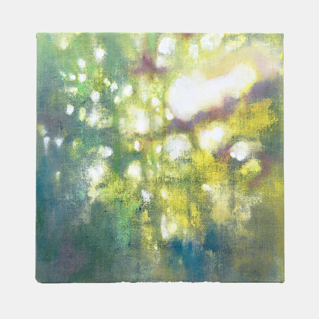 The artwork 'In the Woods' by Takashi Harada features ethereal dappled light effects in soft greens and yellows, creating a dreamy forest canopy impression. Abstract white bokeh spots dance across a misty teal and chartreuse background, rendered in acrylic and cray pastel on cotton canvas. The atmospheric composition evokes sunlight filtering through trees.